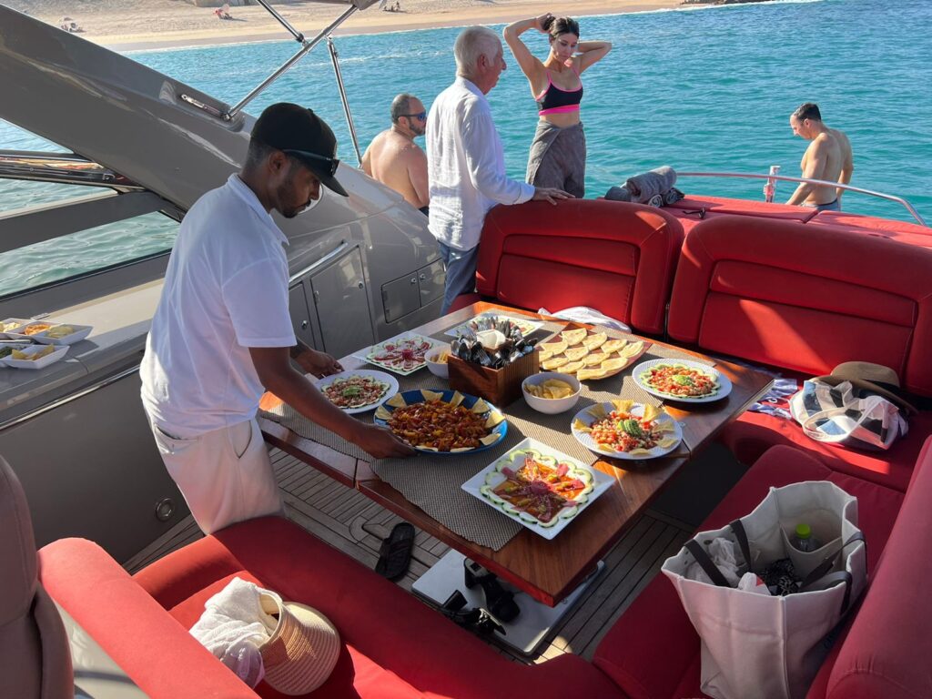 Person serving food on a yacht