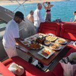 Person serving food on a yacht