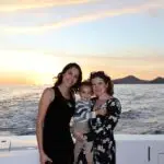Two girls and a baby on a boat